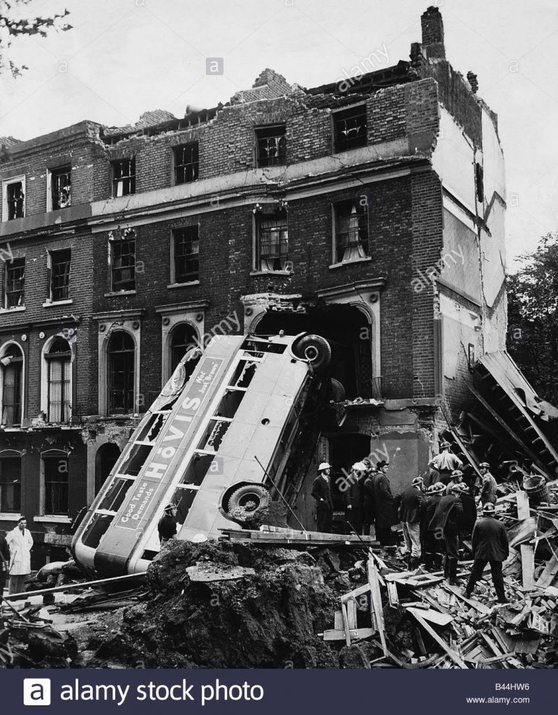 london-double-decker-bus-hit-by-the-blast-from-a-bomb-dropped-during-B44HW6.jpg