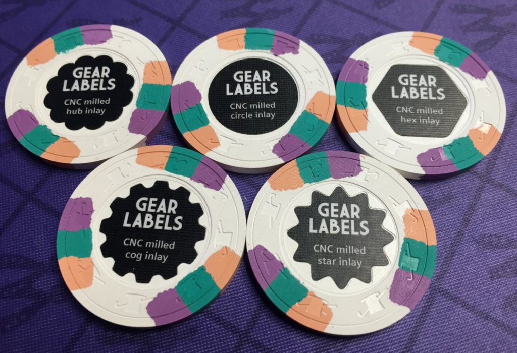 Chris Gear unveils new tech - milled shaped labels!!! - photo by inca 911